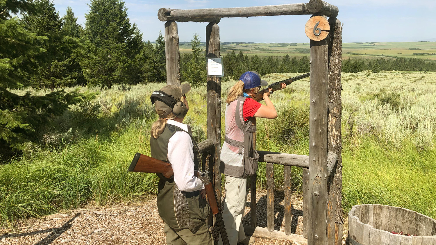 Woman Rifle Shooting with Friend at Lazy Triple Creek Ranch Cast and Blast Lodge in Idaho