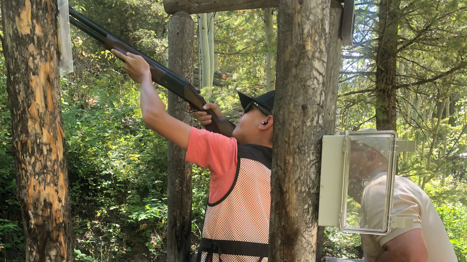 Boy Clays Shooting with Instructor at Lazy Triple Creek Cast and Blast Outfitters
